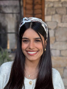קשת לשיער שיפון שמנת עם שיפשופים תכלת סגלגל ושחור